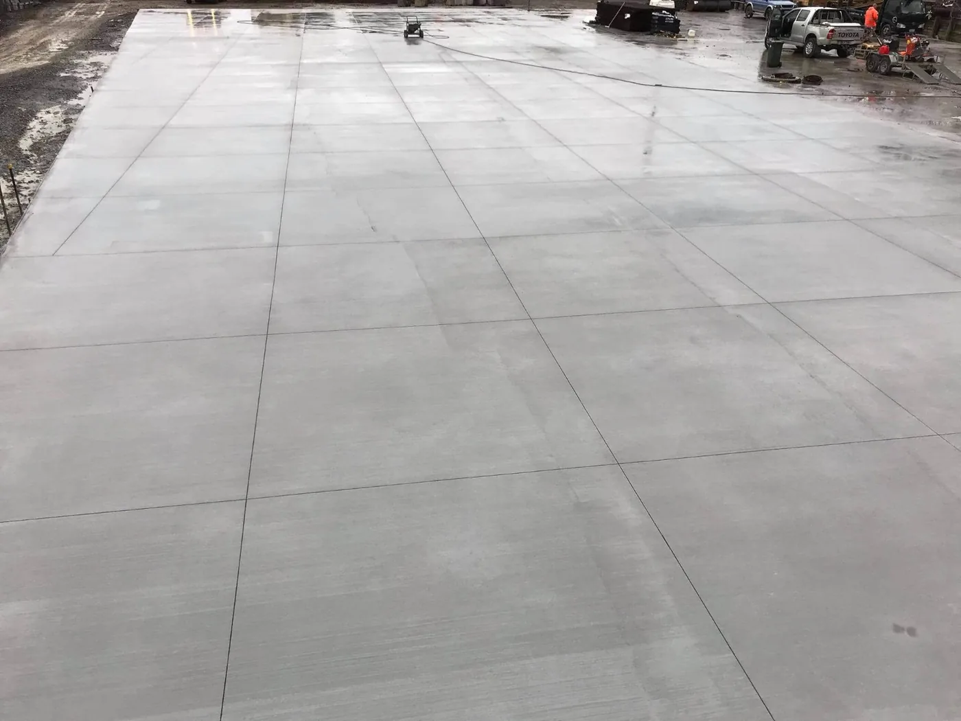 Large commercial concrete slab with clean saw-cut joint layout