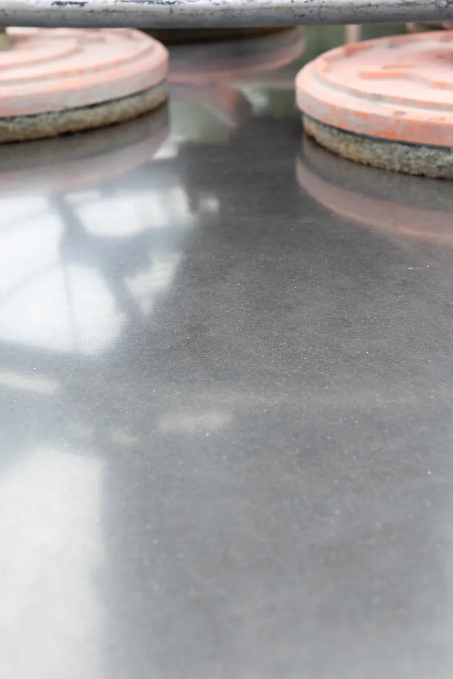 Nil aggregate exposure: a smooth cream polished concrete finish with no stone showing