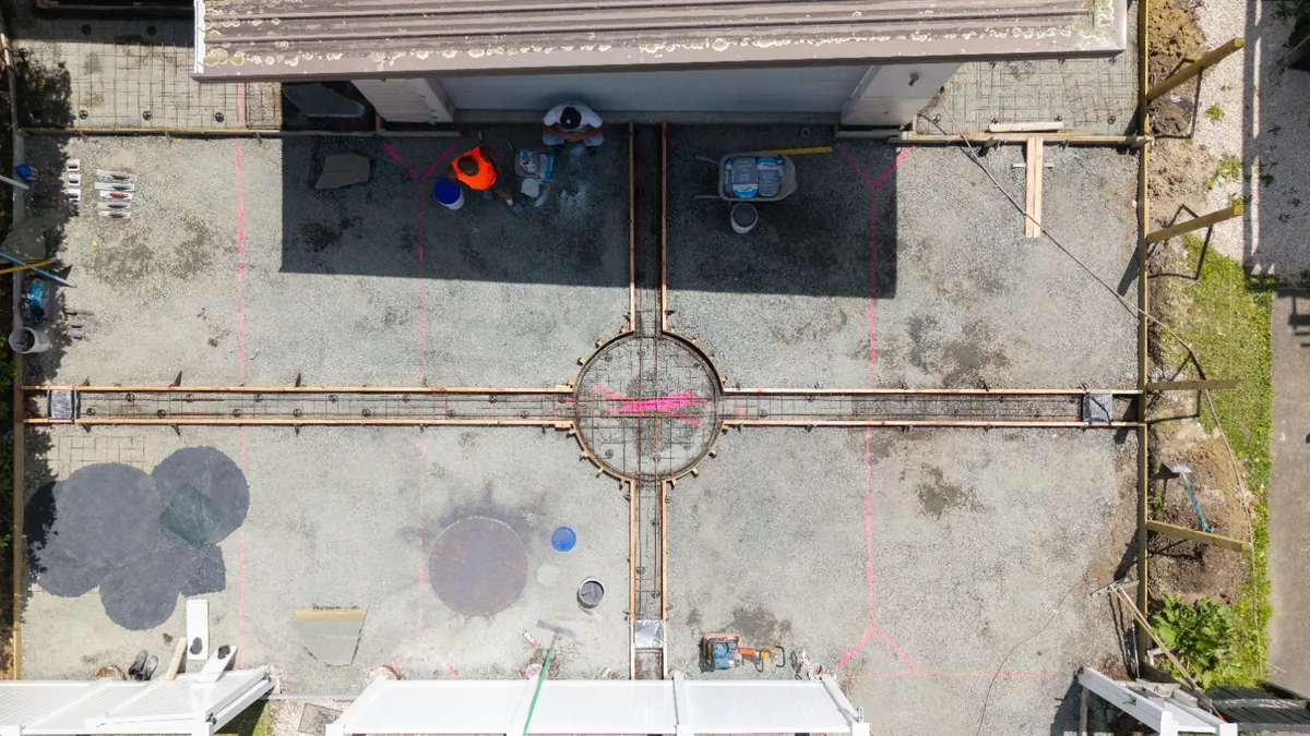 Aerial view of a reinforced concrete base prepared with rebar and a circular centrepiece form